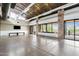 Spacious clubhouse room with stone pillars, large windows, and community gathering space at 10603 E Firewheel Dr, Scottsdale, AZ 85255