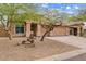 Charming single story home with a three car garage and desert landscaping at 10603 E Firewheel Dr, Scottsdale, AZ 85255