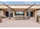 Outdoor lounge area with comfortable seating, shade structure and stone accents for community gatherings at 10603 E Firewheel Dr, Scottsdale, AZ 85255