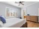 Bright main bedroom with wood-look floors, large window with shutters, and ensuite bathroom at 10603 E Firewheel Dr, Scottsdale, AZ 85255