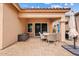 Charming outdoor patio featuring a dining set and grill, ideal for entertaining or enjoying quiet meals at 10603 E Firewheel Dr, Scottsdale, AZ 85255