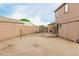 Fenced backyard with space for outdoor activities and potential for customization at 10653 E Lindner Cir, Mesa, AZ 85209