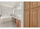 Well-lit bathroom with double sinks, a soaking tub, and a large walk-in shower at 10653 E Lindner Cir, Mesa, AZ 85209