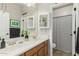 Well-lit bathroom features a double sink vanity with a shower/tub combo at 10653 E Lindner Cir, Mesa, AZ 85209