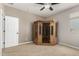 Bedroom featuring neutral paint, a ceiling fan, and a sauna in the corner at 10653 E Lindner Cir, Mesa, AZ 85209