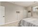 Neutral bedroom with a tv mount, a queen bed, and a window for natural light at 10653 E Lindner Cir, Mesa, AZ 85209
