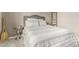 Bedroom featuring oars, a queen bed, and a decorative side table and decor at 10653 E Lindner Cir, Mesa, AZ 85209