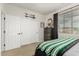 Comfortable bedroom with a baseball theme, two closets, and one window at 10653 E Lindner Cir, Mesa, AZ 85209