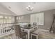 Charming dining area with vaulted ceilings and wood-look floors at 10653 E Lindner Cir, Mesa, AZ 85209