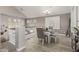 Inviting dining space with a modern table, seating, and shuttered windows at 10653 E Lindner Cir, Mesa, AZ 85209