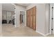 Hallway with carpet flooring and view of the bedroom at 10653 E Lindner Cir, Mesa, AZ 85209