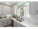 Bright kitchen featuring white countertops, modern sink fixtures, and stainless steel dishwasher at 10653 E Lindner Cir, Mesa, AZ 85209