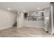 Open living space featuring wood-look tile floors and staircase at 10653 E Lindner Cir, Mesa, AZ 85209