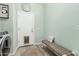 Mud room featuring a bench, coat rack, and a washer and dryer at 10653 E Lindner Cir, Mesa, AZ 85209