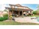 Covered patio with outdoor seating and dining area, perfect for enjoying the backyard at 10653 E Lindner Cir, Mesa, AZ 85209