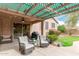 Covered patio with comfortable seating and outdoor grill perfect for entertaining at 10653 E Lindner Cir, Mesa, AZ 85209