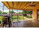 Inviting back patio area with comfortable seating, grill, and view of the spacious, well-maintained backyard at 1143 E 7Th St, Mesa, AZ 85203