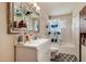 Bathroom featuring a vanity with sink, bathtub, shower, and large mirror at 1143 E 7Th St, Mesa, AZ 85203