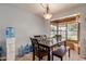 Bright dining room features a window seat and a view of the backyard at 1143 E 7Th St, Mesa, AZ 85203