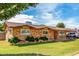 Charming brick home featuring a lush lawn, long driveway, and a covered parking area for your vehicles at 1143 E 7Th St, Mesa, AZ 85203