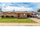Charming brick home featuring a lush lawn, long driveway, and a covered parking area for your vehicles at 1143 E 7Th St, Mesa, AZ 85203