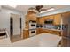 Kitchen with wooden cabinets, a double oven, and stainless steel microwave at 1143 E 7Th St, Mesa, AZ 85203