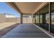 Covered back patio with sliding glass doors and view of the backyard at 11996 N Luckenbach St, Surprise, AZ 85388