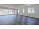 Bright, open living room featuring large windows and sliding glass doors at 11996 N Luckenbach St, Surprise, AZ 85388