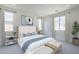 Serene bedroom with neutral tones, large windows, and comfortable furnishings, a relaxing retreat at 11996 N Luckenbach St, Surprise, AZ 85388