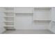 Bright walk-in closet with built-in shelving and clothing rods at 11996 N Luckenbach St, Surprise, AZ 85388