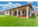 Beautiful backyard patio and putting green with artificial grass and covered area at 1303 W Cherrywood Dr, Queen Creek, AZ 85140