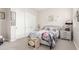 Charming bedroom with neutral tones, double sliding closet doors, and delightful Paris-themed decorations and furnishings at 1303 W Cherrywood Dr, Queen Creek, AZ 85140