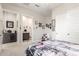 Well-lit bedroom with en-suite bathroom, closet with sliding doors and French-themed decorations, creating a serene space at 1303 W Cherrywood Dr, Queen Creek, AZ 85140
