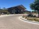 Exterior view of the community clubhouse with covered entry and desert landscaping at 1303 W Cherrywood Dr, Queen Creek, AZ 85140
