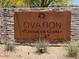 Signage for Ovation Recreation Center with stone detail and native desert landscaping at 1303 W Cherrywood Dr, Queen Creek, AZ 85140