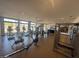 Spacious fitness center offering a variety of modern exercise equipment and large windows at 1303 W Cherrywood Dr, Queen Creek, AZ 85140