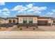 Stunning single story home featuring a symmetrical facade, low maintenance landscaping, and a two car garage at 1303 W Cherrywood Dr, Queen Creek, AZ 85140