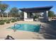 Hot tub at the recreation center features a pergola covered outdoor kitchen and eating area at 1303 W Cherrywood Dr, Queen Creek, AZ 85140