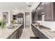 Beautiful kitchen boasts stainless appliances and granite countertops at 1303 W Cherrywood Dr, Queen Creek, AZ 85140