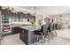 Beautiful kitchen featuring a large center island, stainless steel appliances, and stylish barstools at 1303 W Cherrywood Dr, Queen Creek, AZ 85140