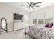 Relaxing main bedroom with carpet, a ceiling fan, and door to the yard at 1303 W Cherrywood Dr, Queen Creek, AZ 85140