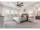 Main bedroom with carpet, a ceiling fan, and windows for natural lighting at 1303 W Cherrywood Dr, Queen Creek, AZ 85140
