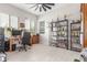Home office with tile flooring, a ceiling fan, and shelving units at 1303 W Cherrywood Dr, Queen Creek, AZ 85140
