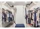 Spacious walk-in closet with ample storage space and custom shelving, perfect for organizing clothes and accessories at 1303 W Cherrywood Dr, Queen Creek, AZ 85140