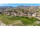 Golf course real estate featuring homes bordering the lush green fairways with scenic mountain views at 1447 E Nighthawk Way, Phoenix, AZ 85048