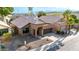 An aerial view of a single-story home with desert landscaping, tile roof, and a two car garage at 1447 E Nighthawk Way, Phoenix, AZ 85048