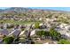 Scenic aerial view showcasing lush green fairways and manicured lawns, perfect for golf enthusiasts at 1447 E Nighthawk Way, Phoenix, AZ 85048