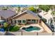 Inviting backyard features a uniquely shaped pool, perfect for relaxation and outdoor enjoyment at 1447 E Nighthawk Way, Phoenix, AZ 85048