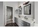 Bathroom showcasing a double sink vanity with modern fixtures, framed mirrors, and a walk-in shower at 1447 E Nighthawk Way, Phoenix, AZ 85048