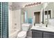 Bright bathroom featuring shower-tub combination and a vanity with sleek countertops and lighting at 1447 E Nighthawk Way, Phoenix, AZ 85048